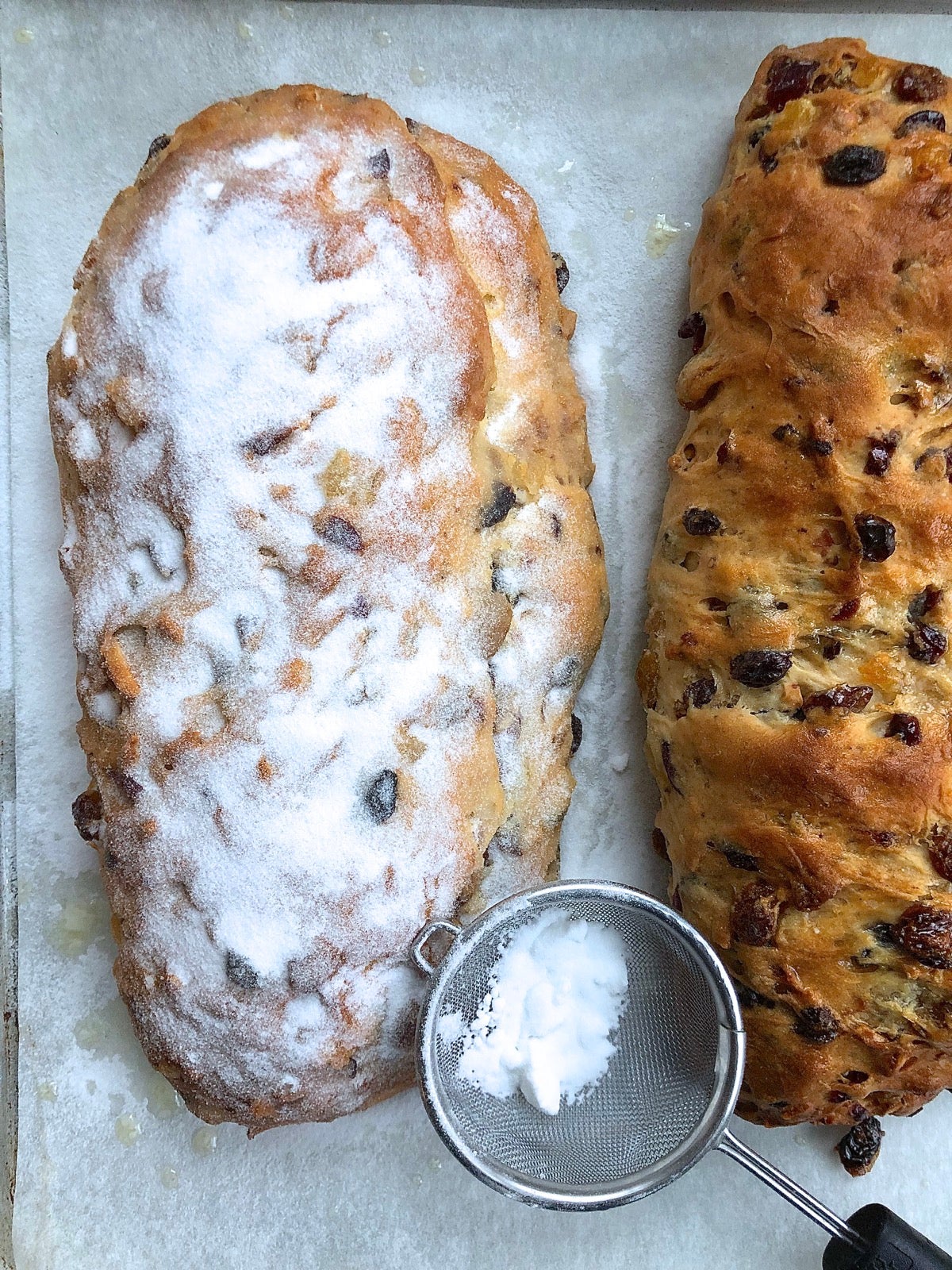 Finished stollen brushed with butter and showered with superfine sugar.