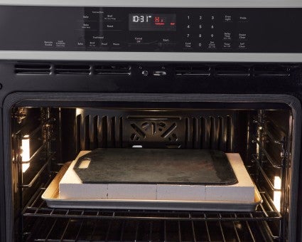 Steel on top of firebricks in a home oven 