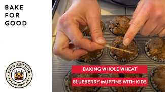 Hands testing baked muffins