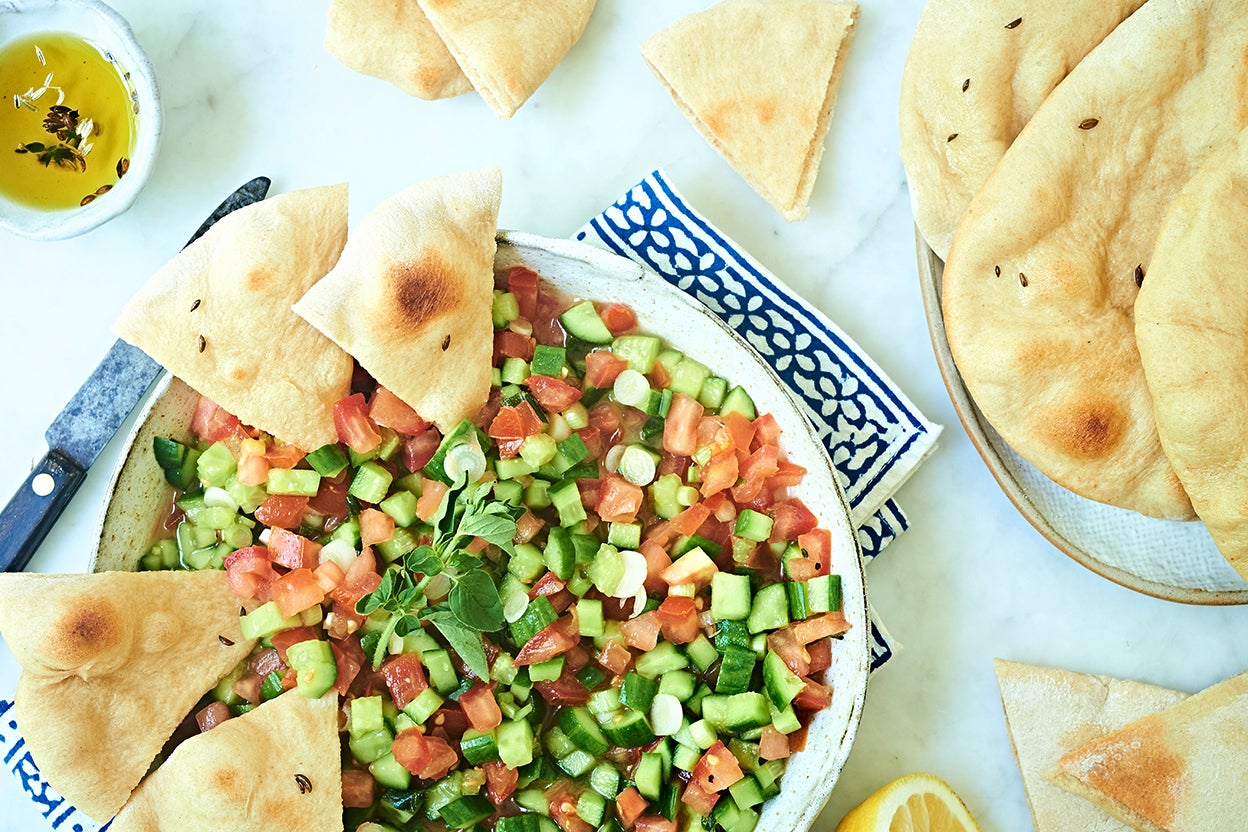 https://www.kingarthurbaking.com/sites/default/files/2019-08/whole-wheat-pita-with-middle-eastern-salad.jpg