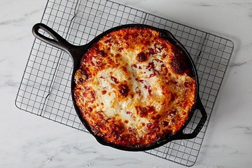 How to Make the Crispiest, Cheesiest Cast-Iron Pan Pizza 