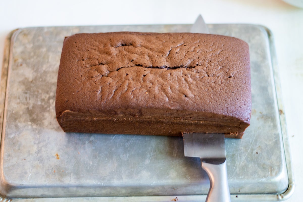 Cutting Chocolate Cassata cake into thirds