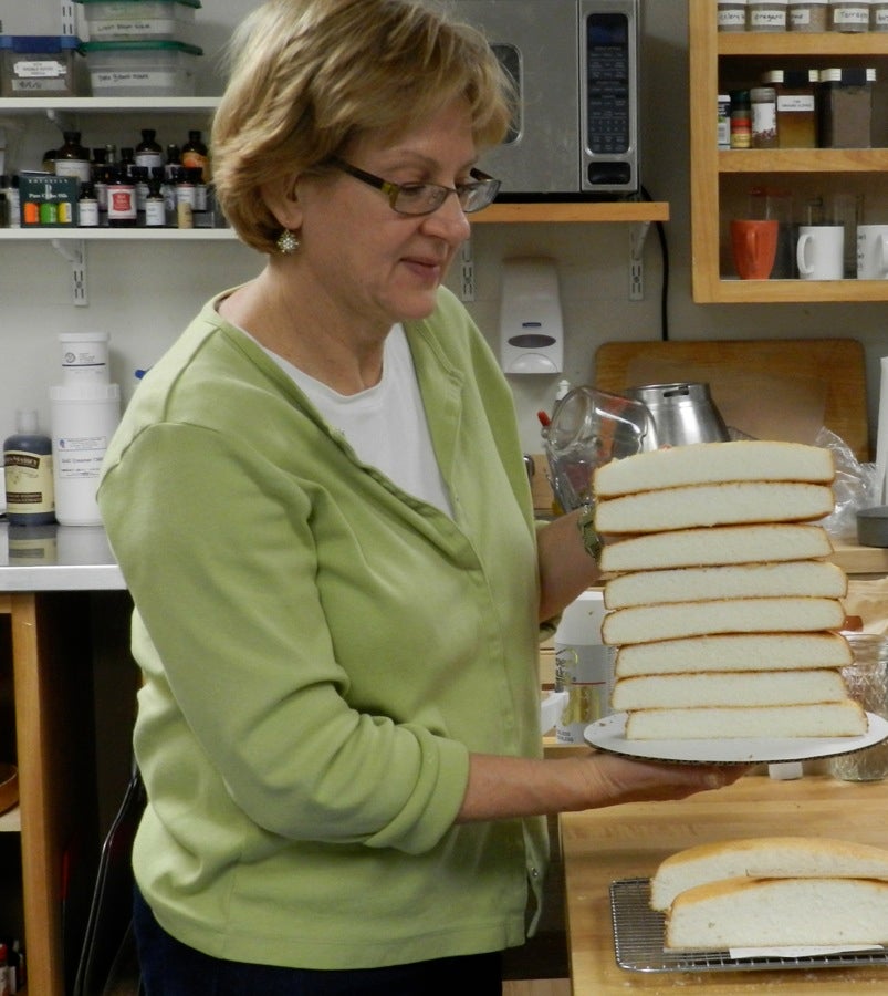 https://www.kingarthurbaking.com/sites/default/files/blog-images/2014/05/sue-with-white-cake.jpg