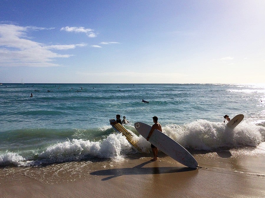 Surfers out doing surfer stuff. 