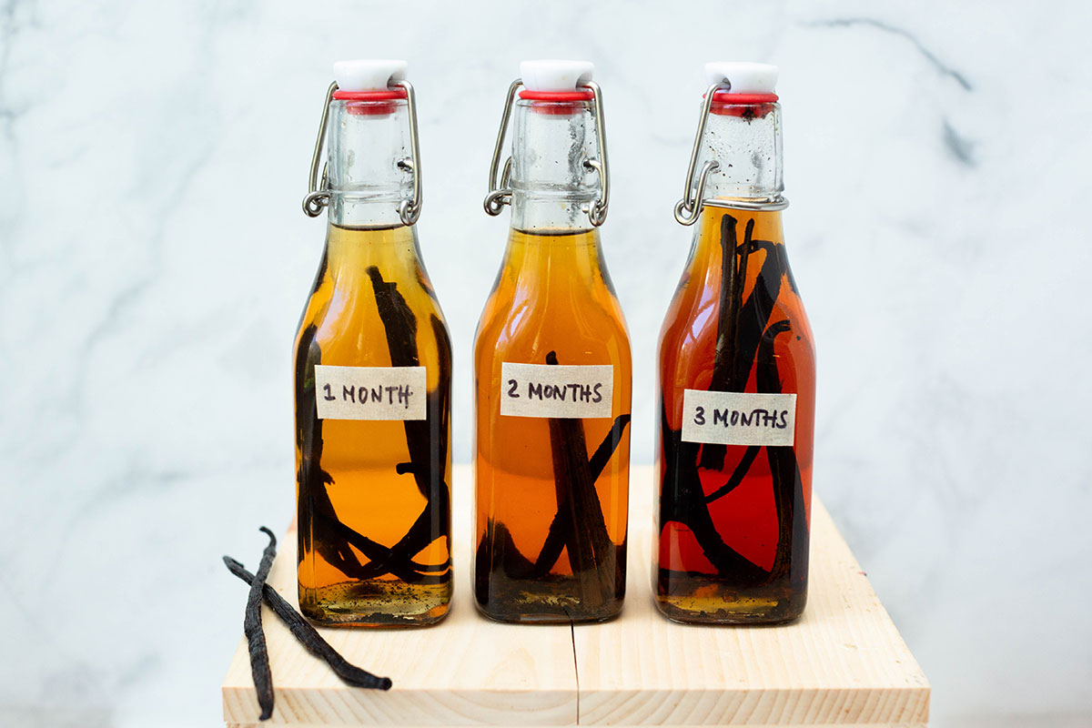 Three bottles of vanilla extract that have been aged for varying amounts of time: 1 month, 2 months, and 3 months.