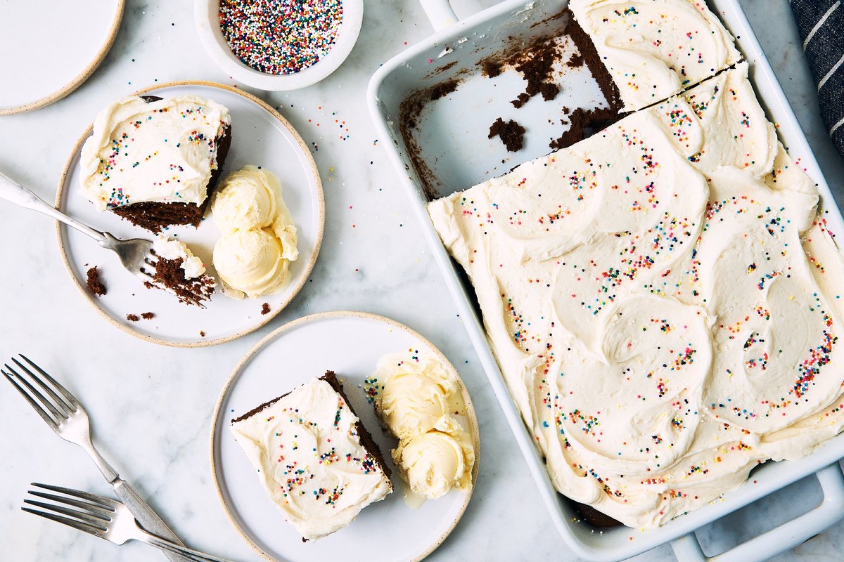 Frosted chocolate sheet cake and two slices plated with ice cream