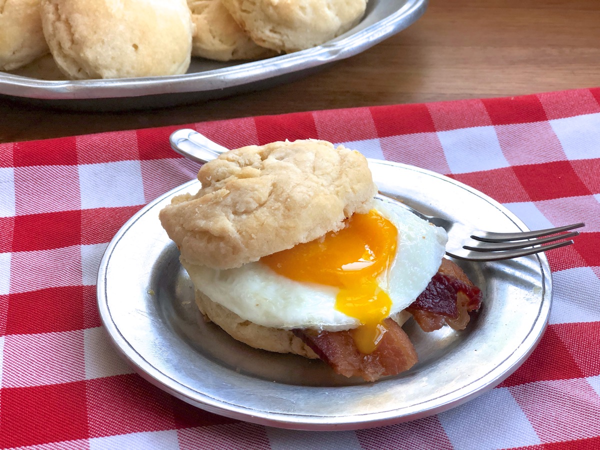 Bacon and egg breakfast sandwich made on a sourdough biscuit.