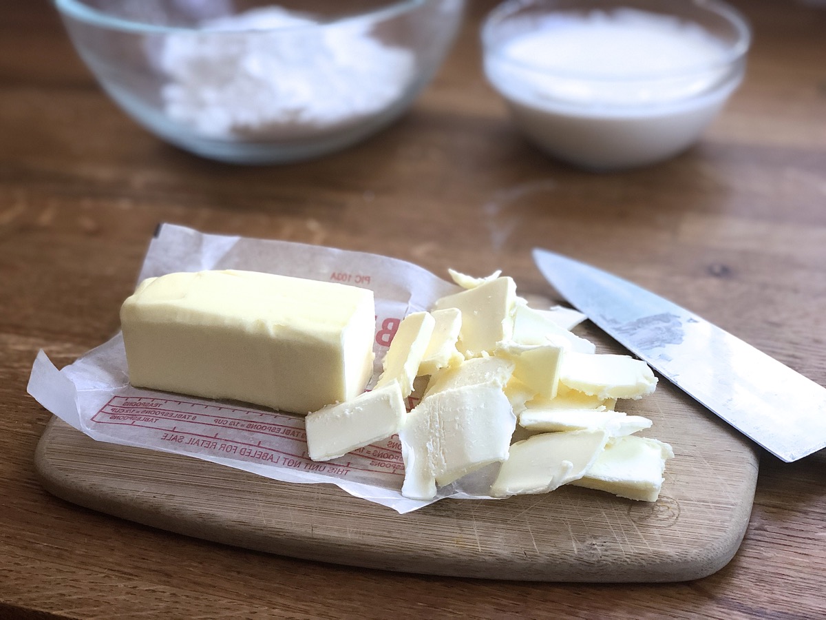 Stick of butter sliced thin, ready to combine with the dry ingredients.