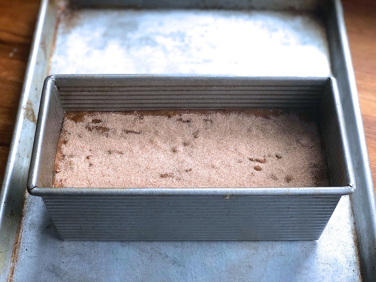 Banana bread batter poured into a 9" x 4" pan.