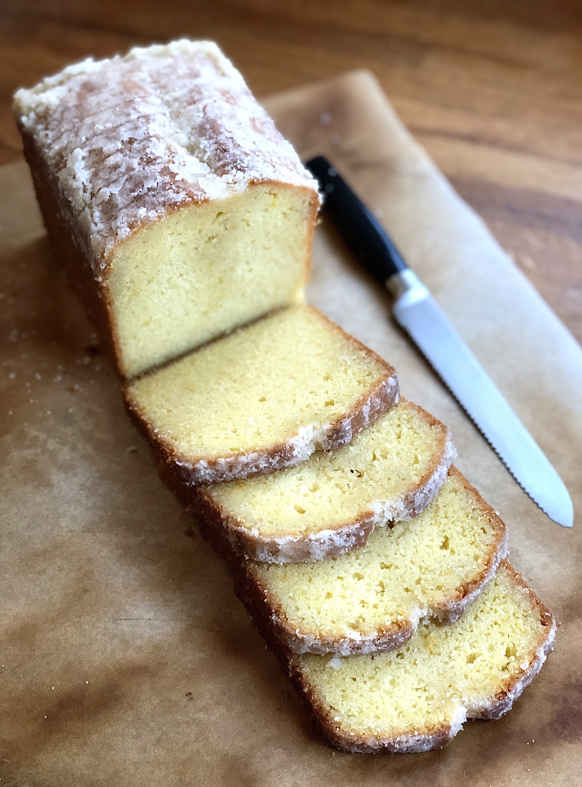 Orange pound cake, baked in a 9" x 4" pan then sliced on a cutting board