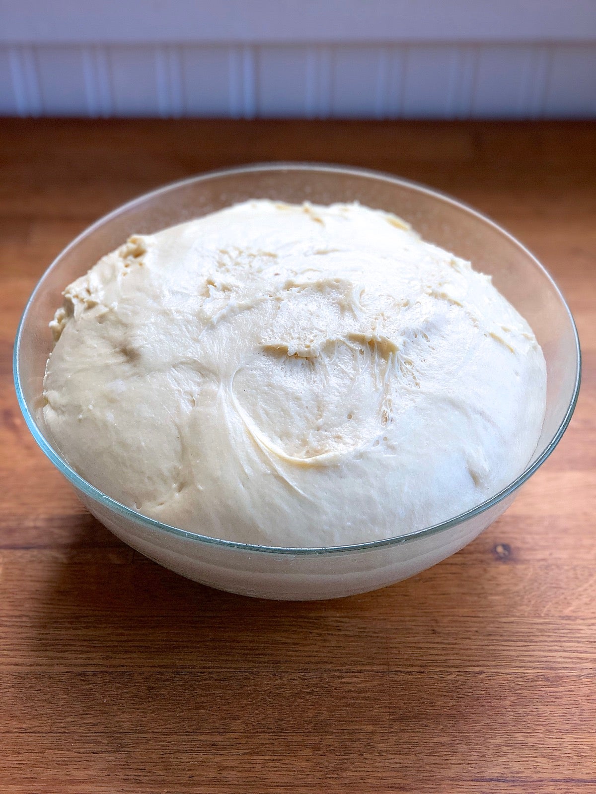 Dough for Amish Dinner rolls in a bowl, nicely risen after 2 hours.