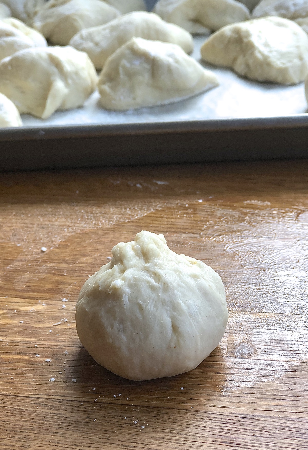 Piece of dough rolled into a rough ball.