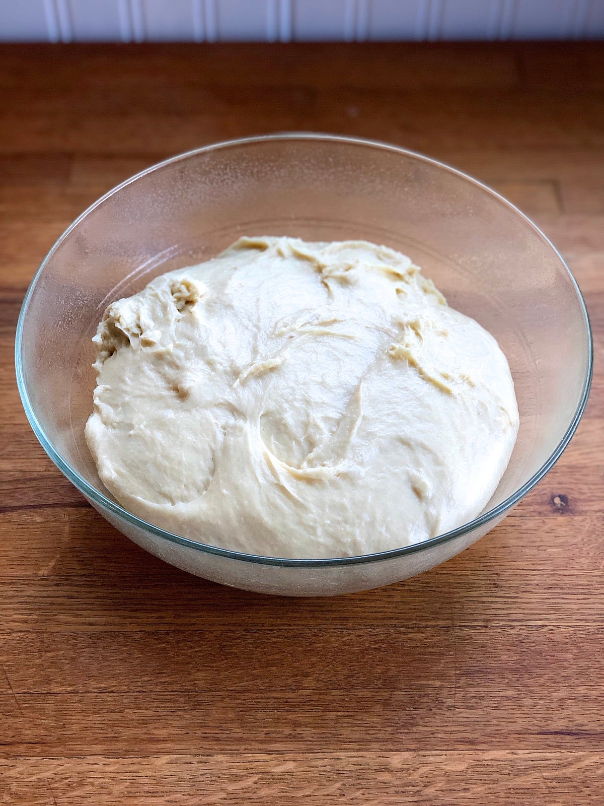 Kneaded dough for Amish Dinner Rolls in a greased bowl, ready to rise.