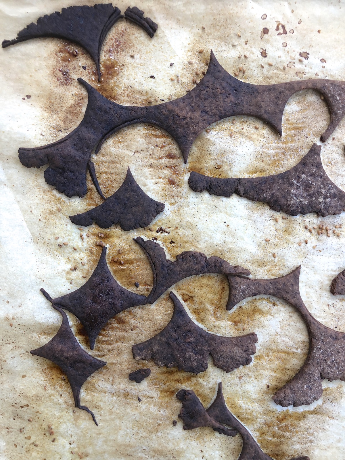 Burned pie crust scraps on a baking sheet.