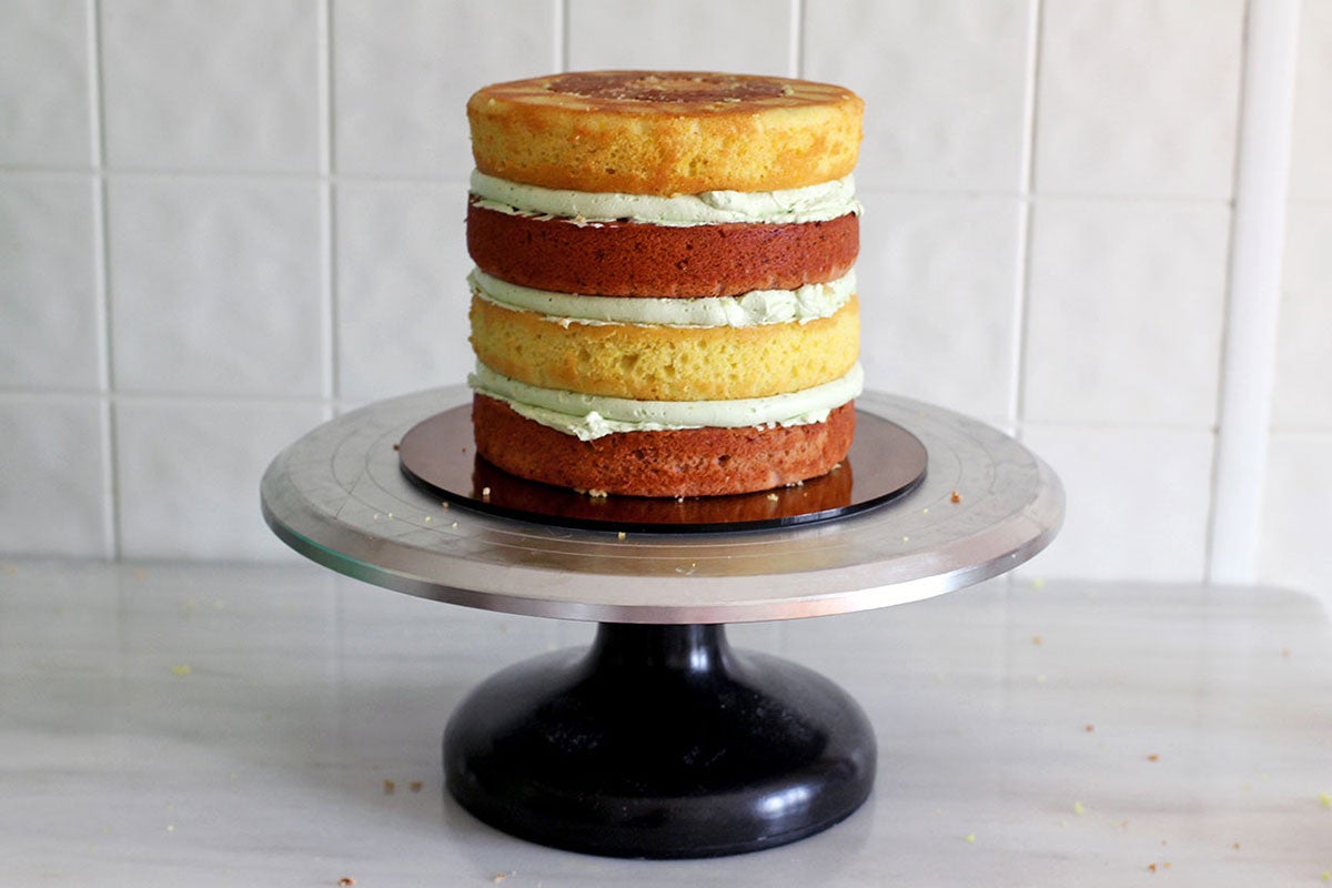 Assembled, unfrosted checkerboard cake