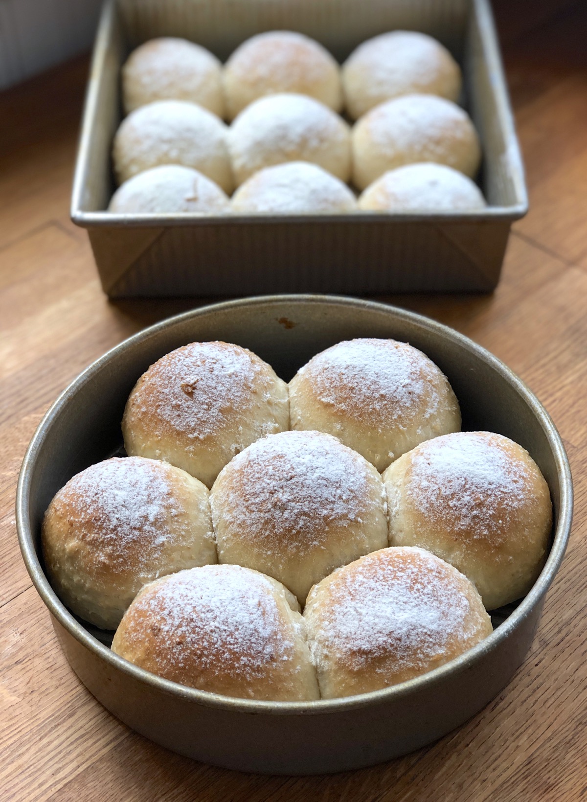 Oatmeal bread dough shaped into dinner rolls and baked