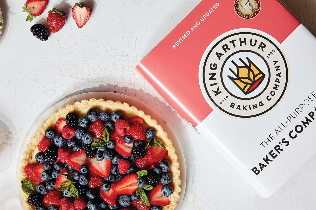 New Baker's Companion cookbook next to tart