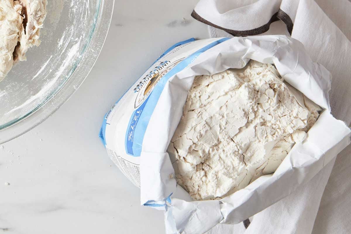 Top down view of open bag of bread flour