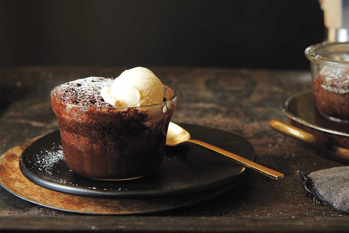 A ramekin of chocolate pudding cake