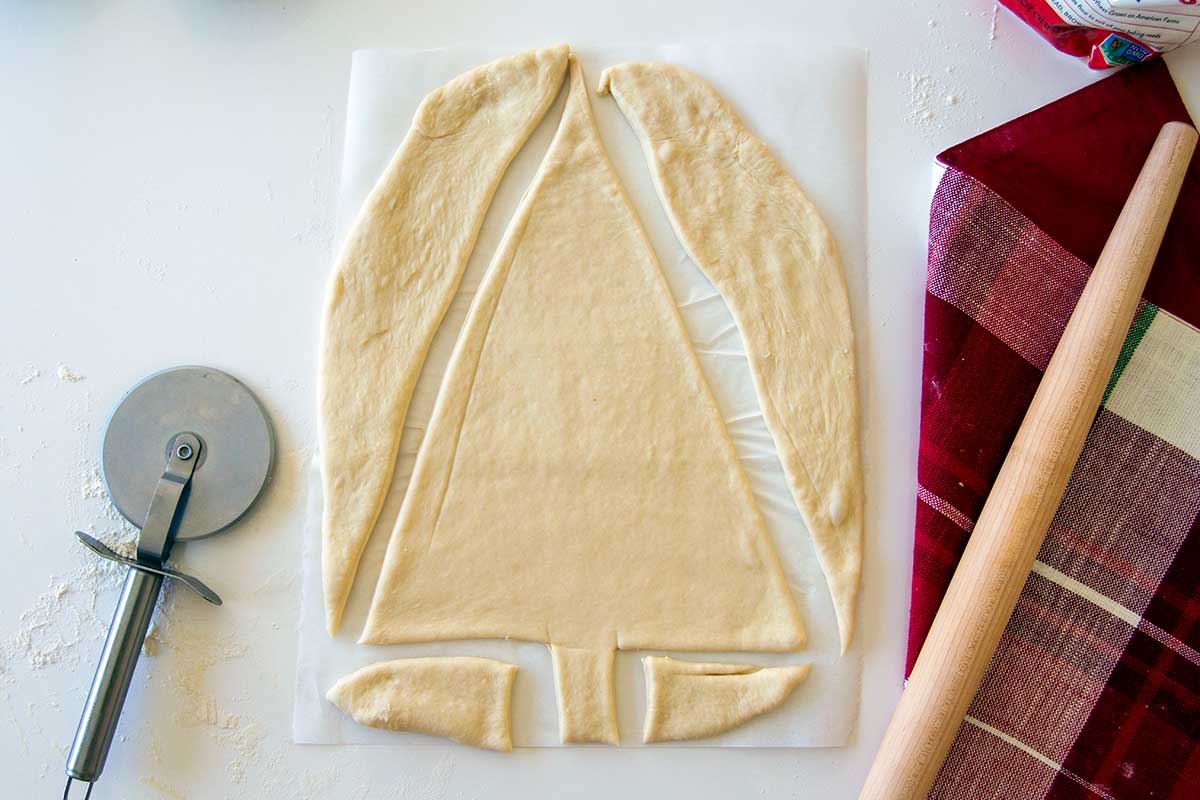 Dough cut into Christmas tree shape