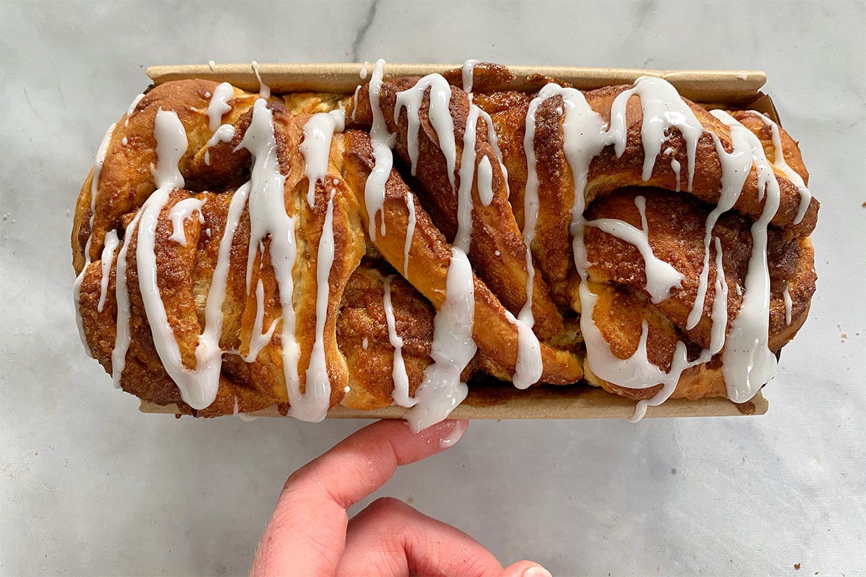 A cinnamon bun loaf glazed with icing