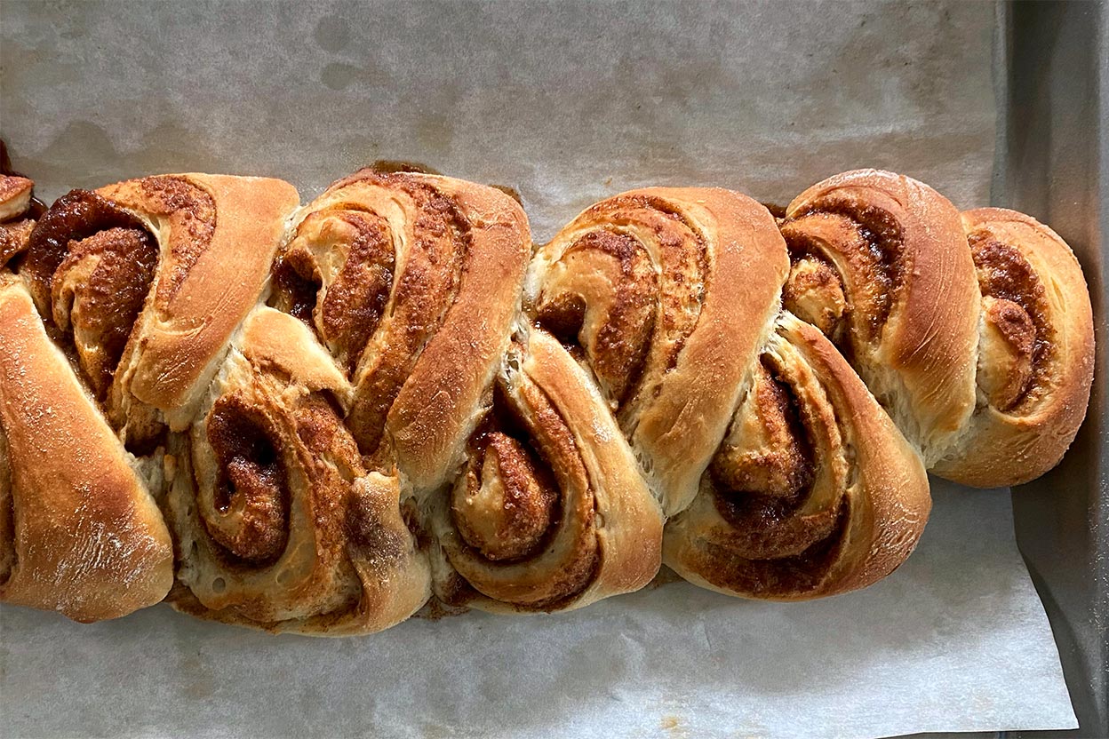 A baked loaf of cinnamon bun bread