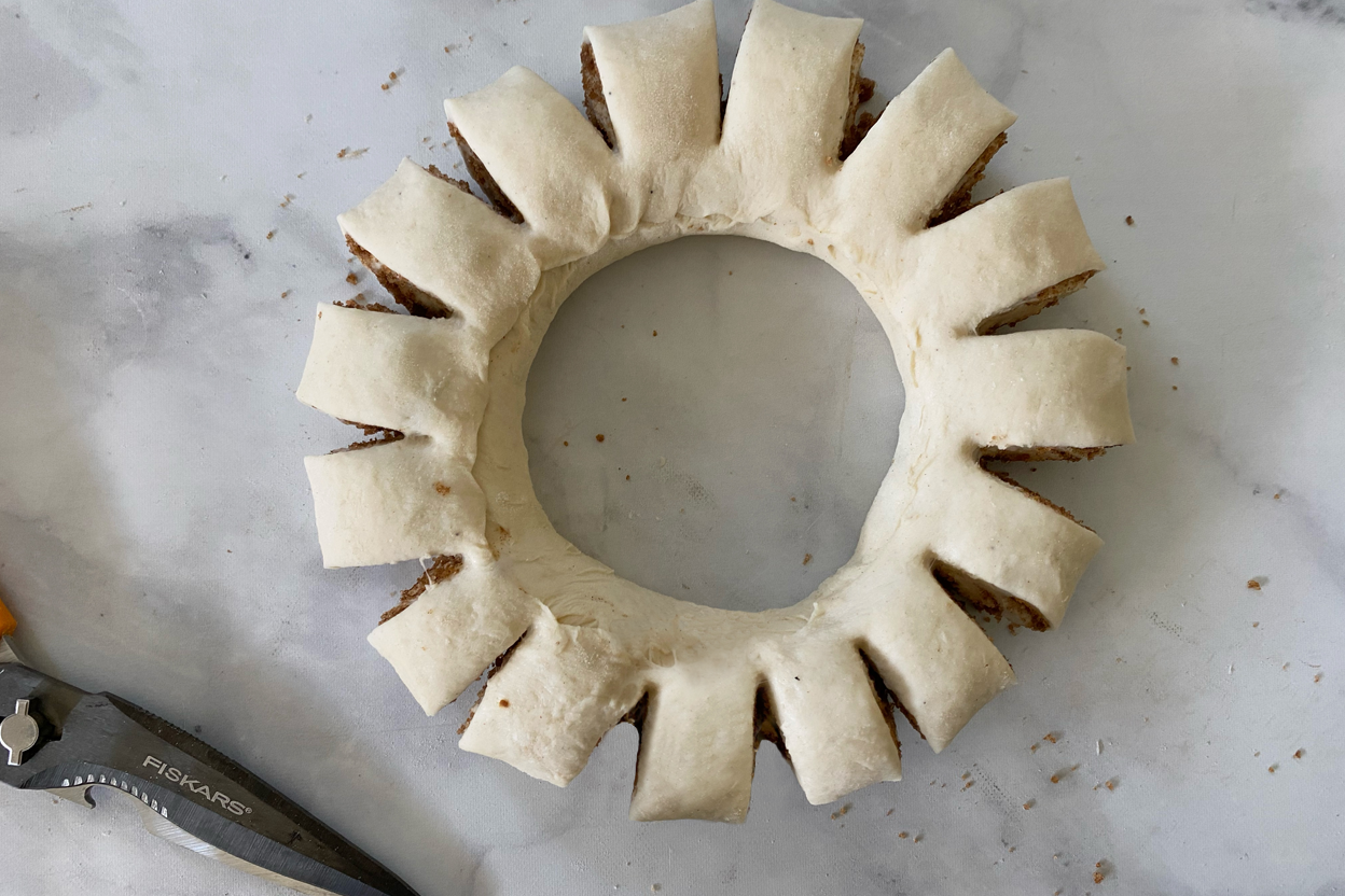 A Swedish tea ring made from a log of cinnamon roll dough