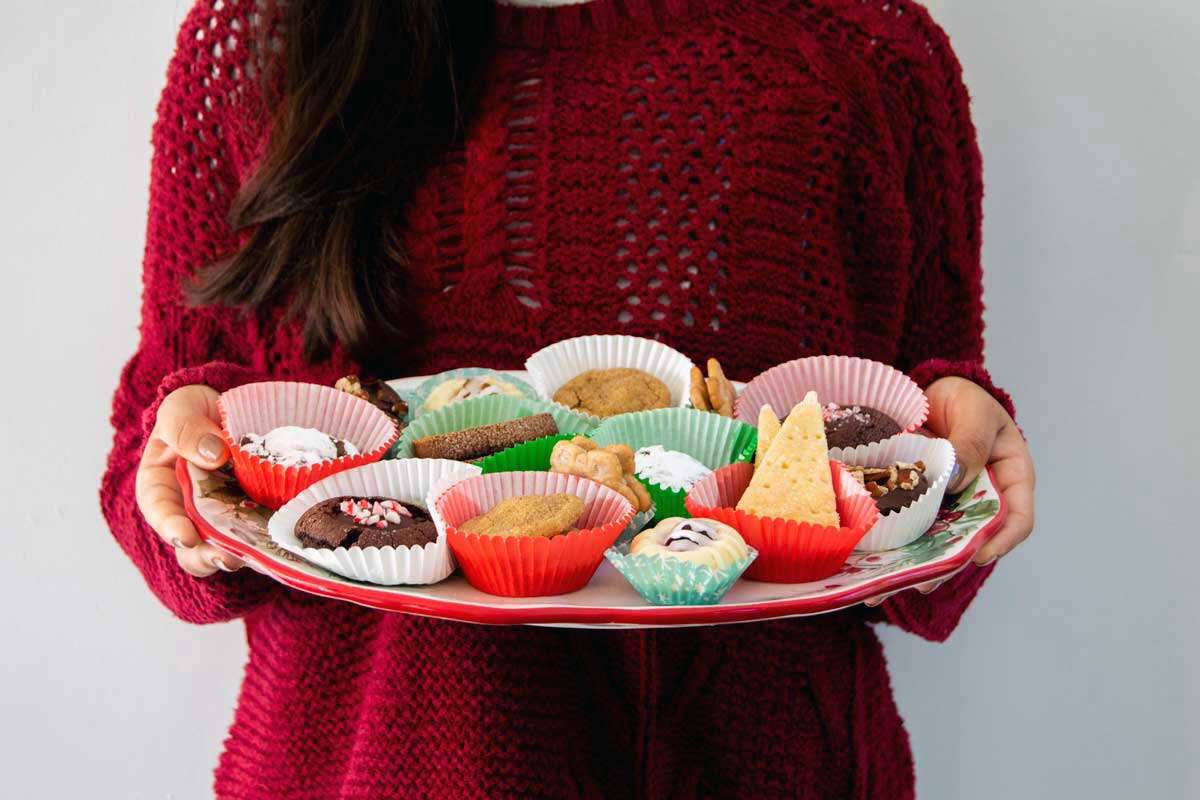 Woman holding up a cookie plate