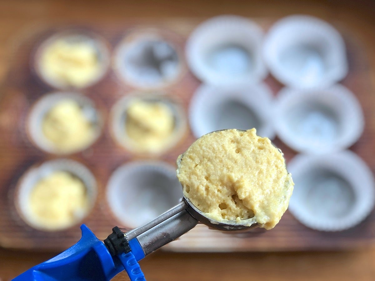 Muffin scoop slightly heaped with cornbread batter