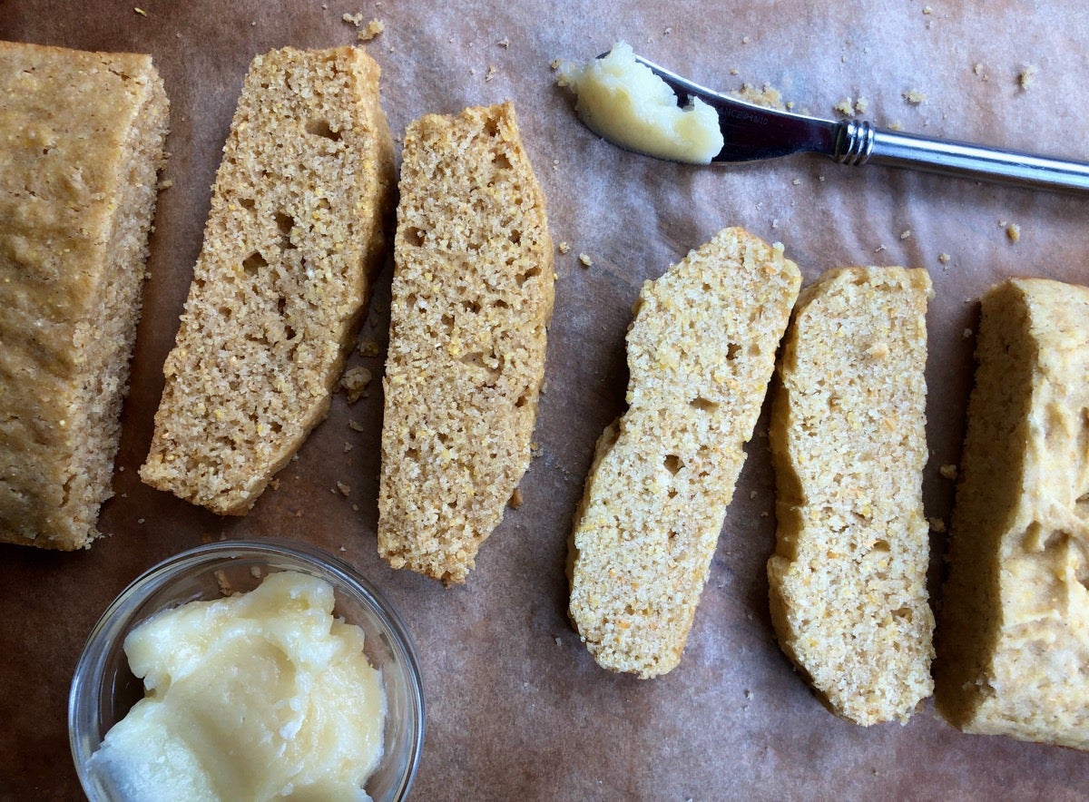 Two loaves of cornbread, sliced: one made with whole wheat, one with gluten-free Measure for Measure flour