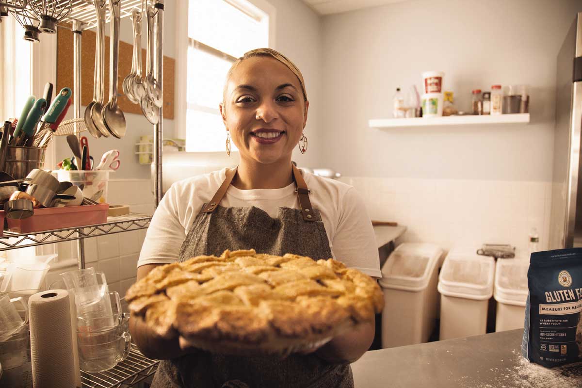 Cristal holding out a pie