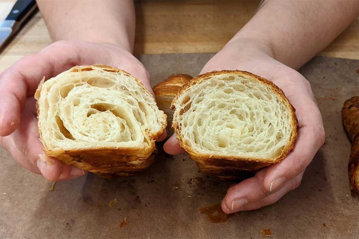 Interiors of two croissants side-by-side: in the left croissant the layers are unevenly separated, in the right one they are even with small spaces