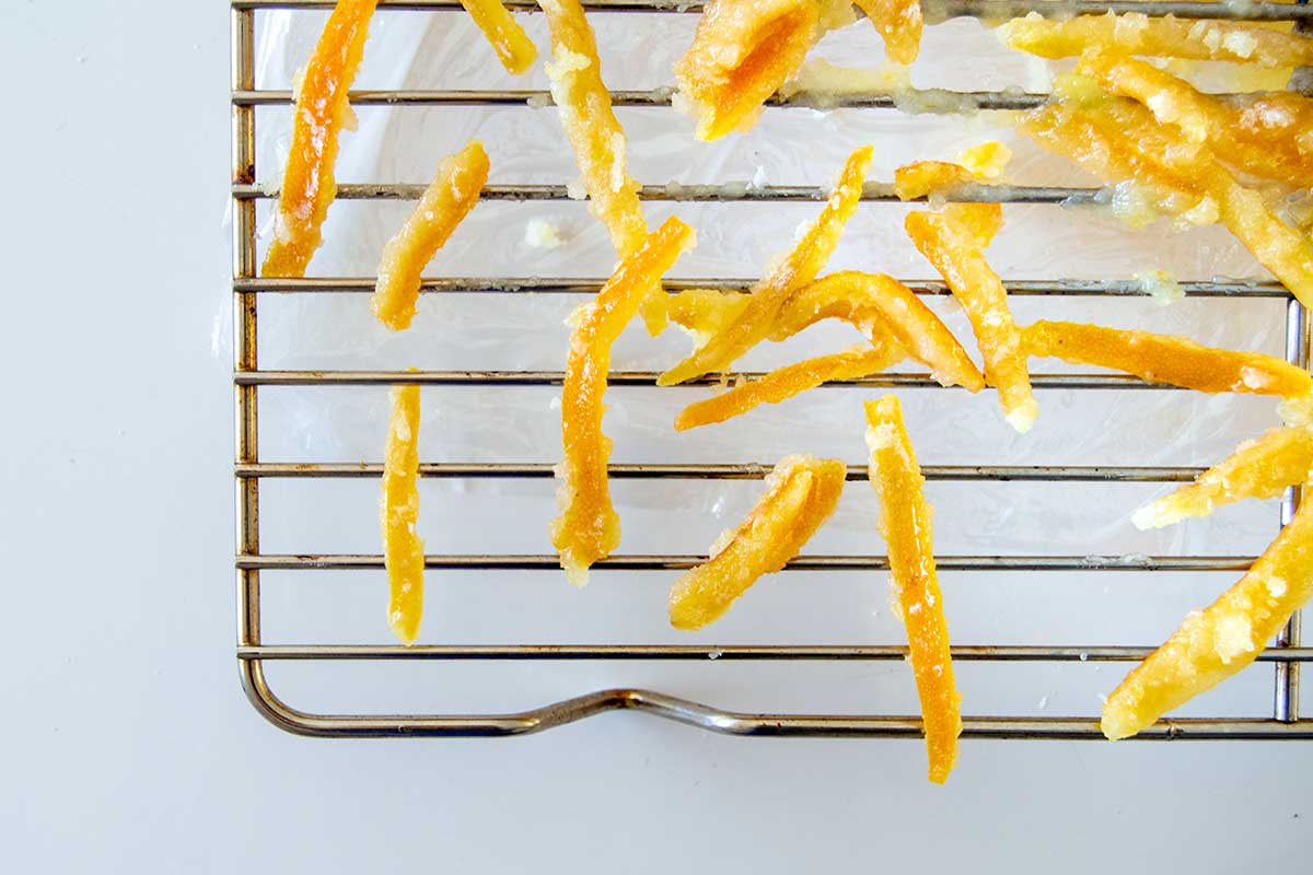 Candied orange peels on a drying rack