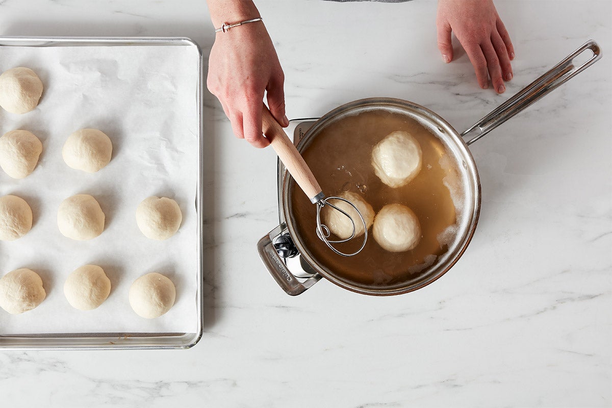 Dough whisk used to extract boiling bagel buns