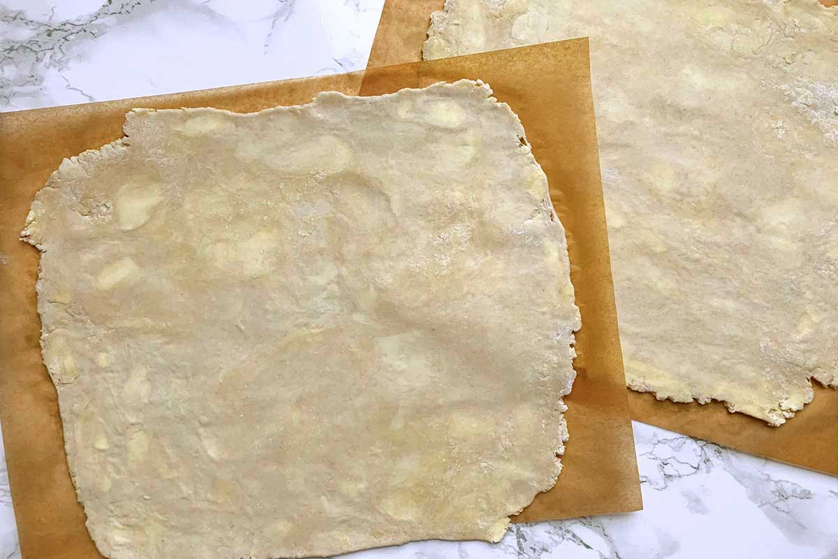 Two square sheets of rolled dough