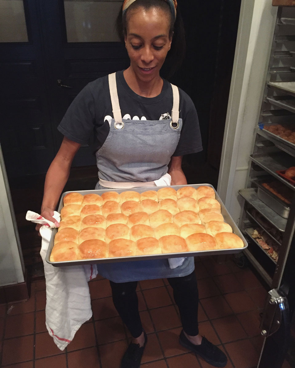Erika holding a tray of biscuits