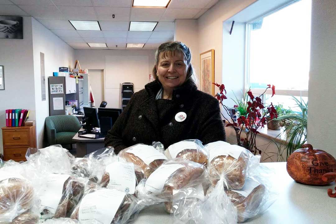Woman with baked loaves