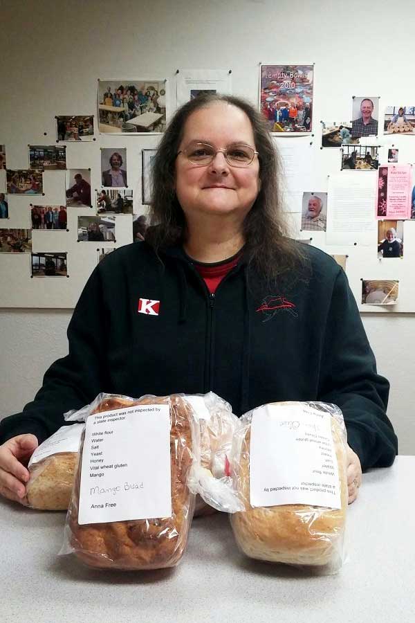 Anna Free with loaves of bread