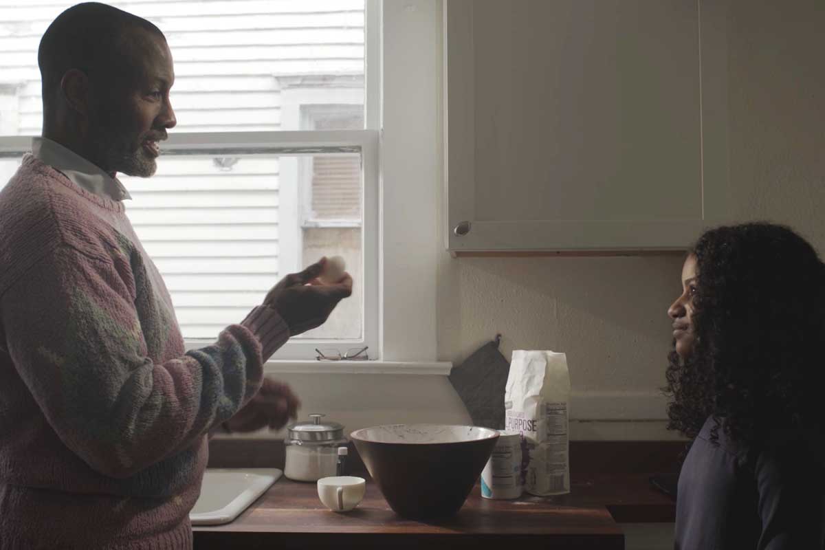 Grandfather and granddaughter baking in film 