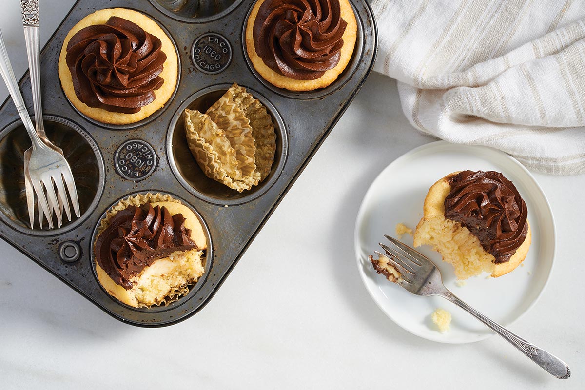 Yellow cupcakes filled with chocolate ganache