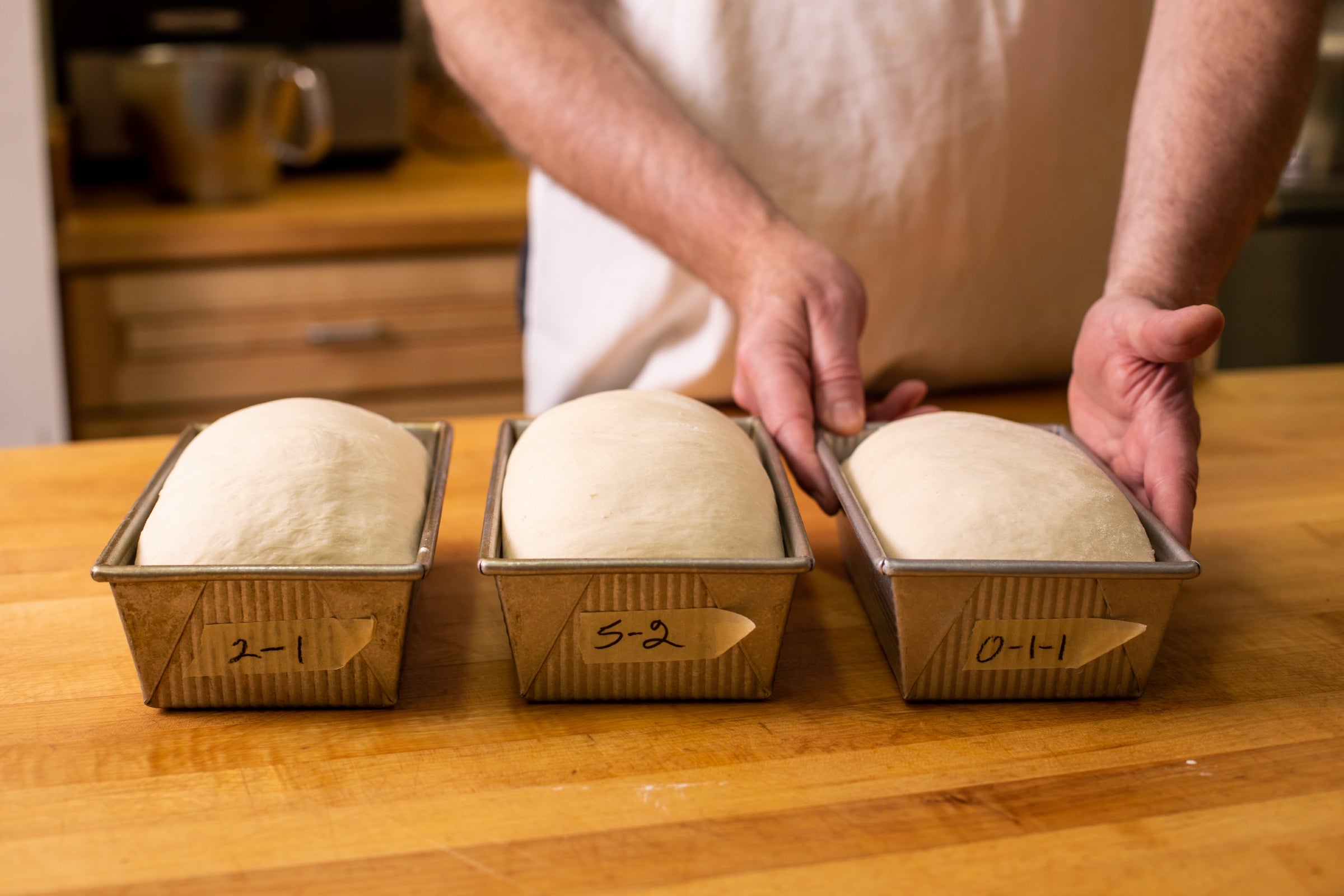 Dough sits in baking pans, ready for the oven