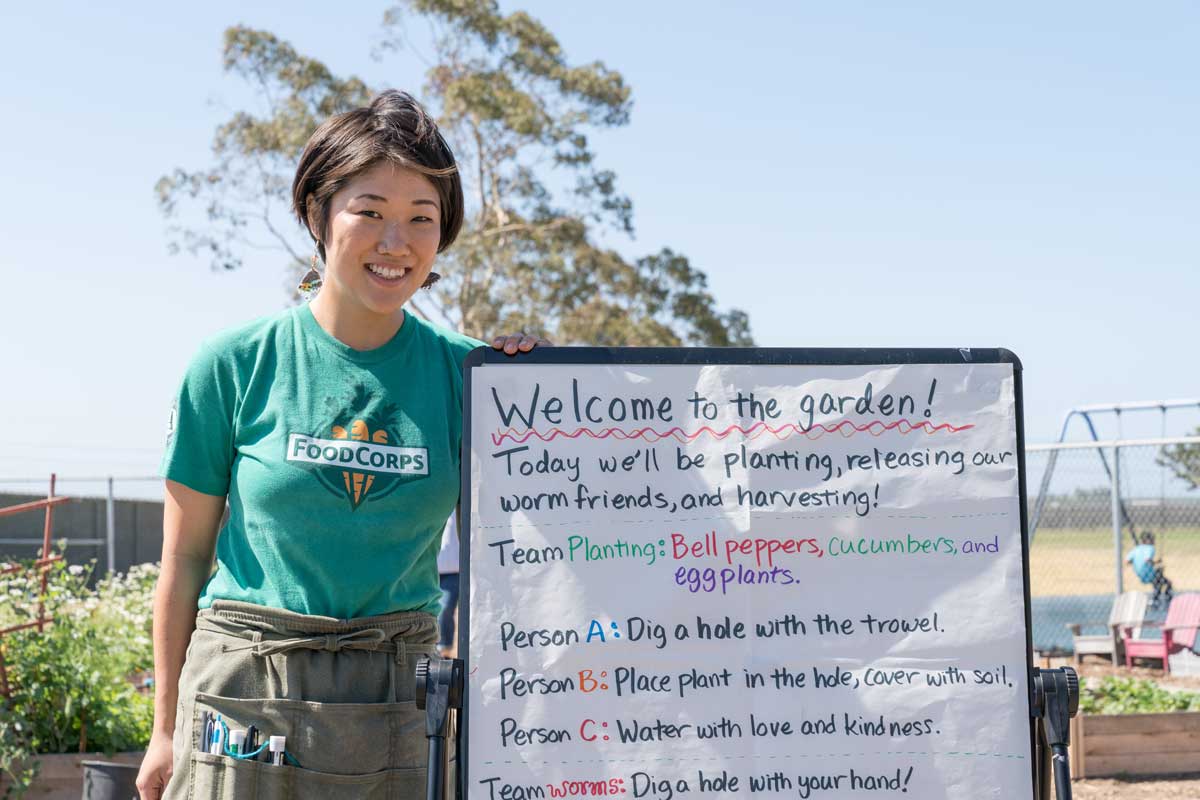 FoodCorps service member in a garden