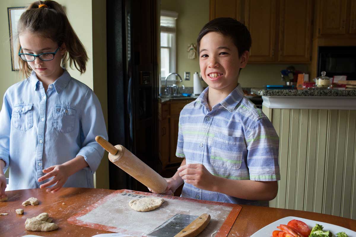 Kids baking with rolling pin 