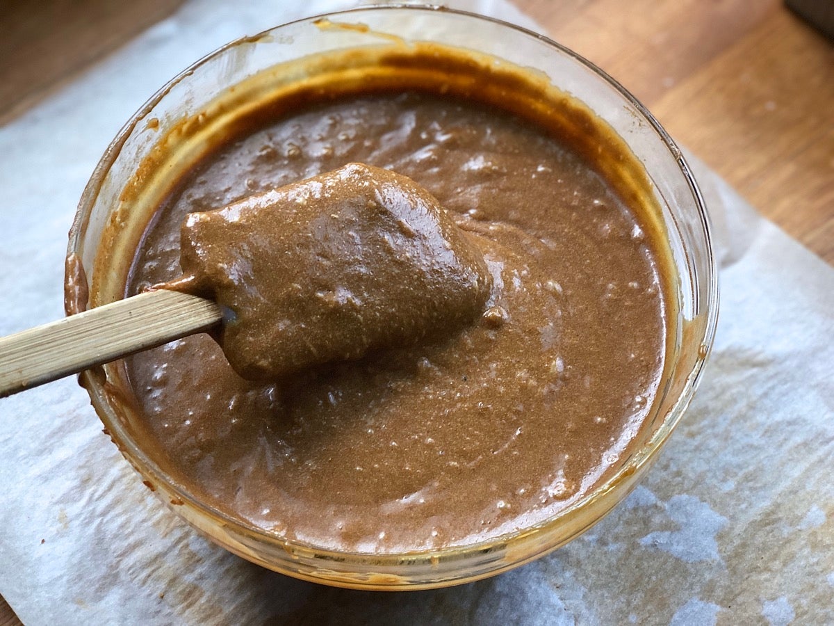 Gingerbread batter in a bowl, ready to be poured into a pan and baked.