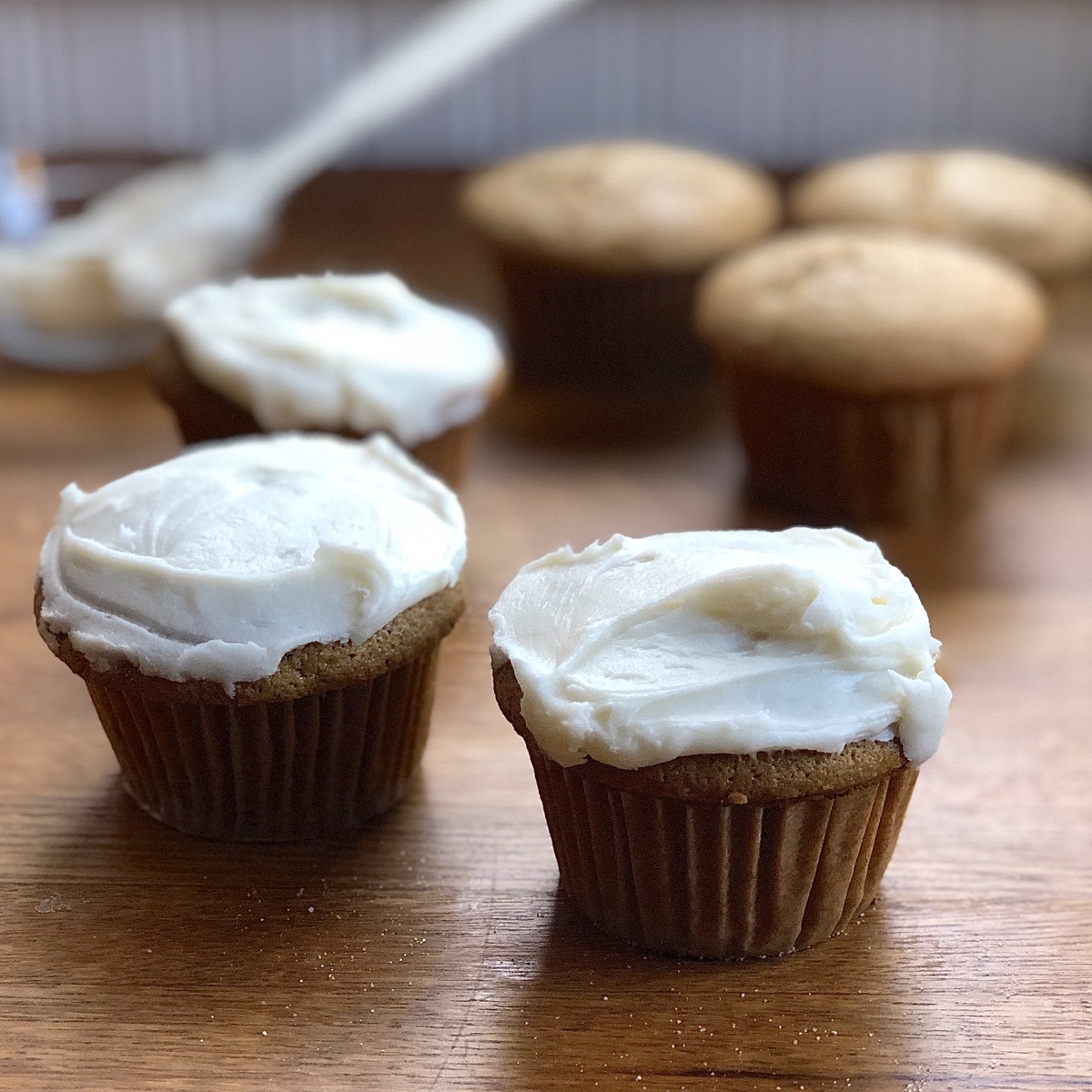 Gingerbread cupcakes with vanilla icing.