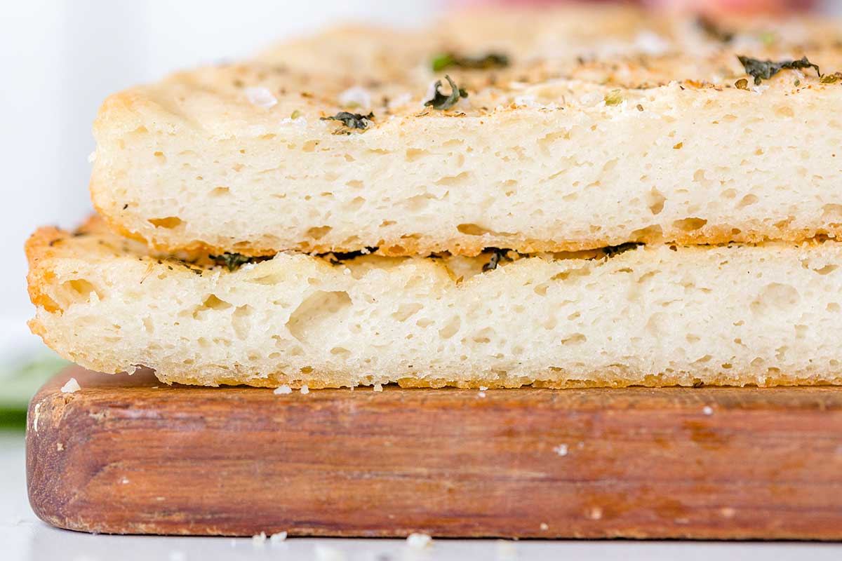 A cross-section of the gluten-free pizza crust showing the open crumb