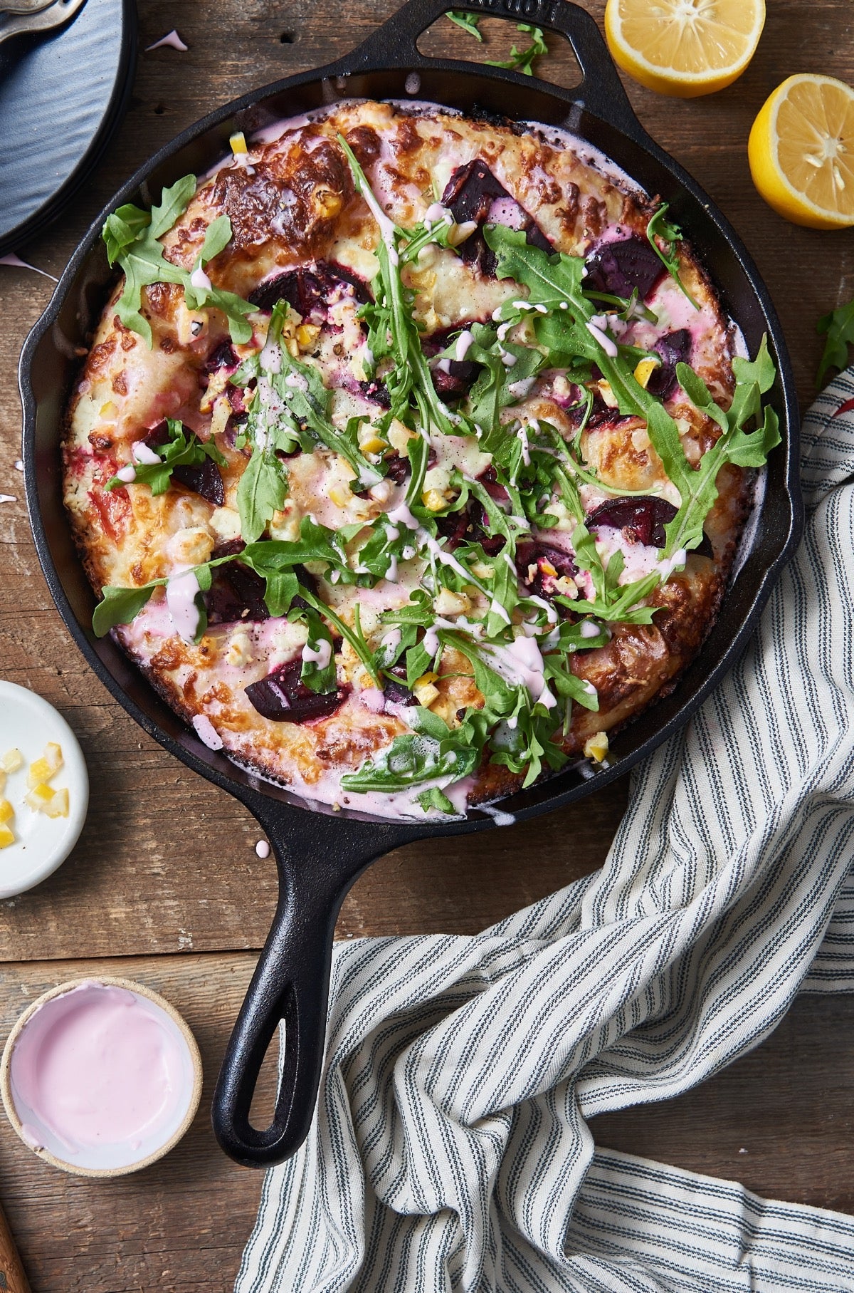 Beet, feta cheese, Meyer lemon, and arugula topped pizza.