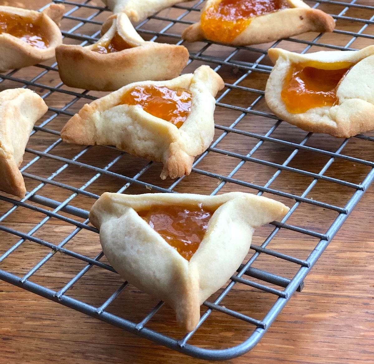 Hamantaschen cooling on a rack.