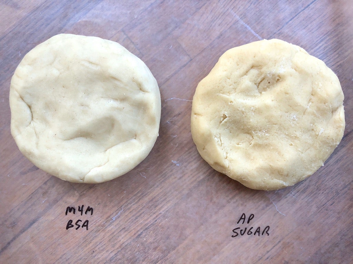 Two discs of hamantaschen dough, ready to be wrapped and refrigerated.