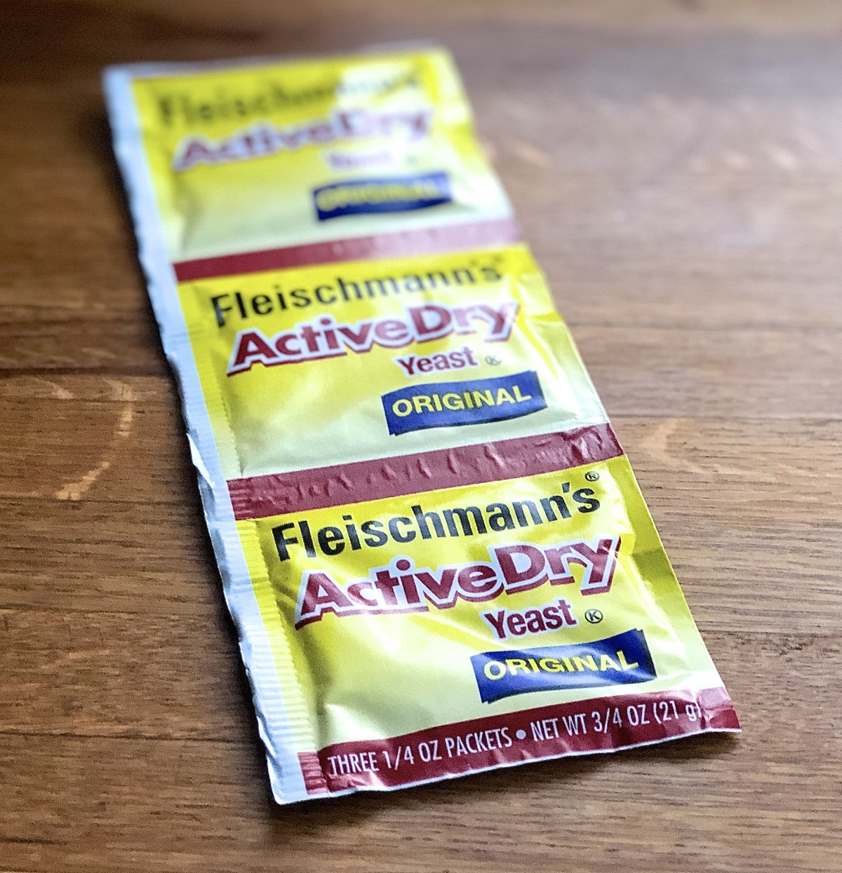 Three-pack strip of Fleischmann's active dry yeast.